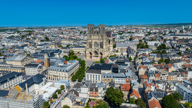 View of Notre Dame cathedral from above showcasing surrounding cityscape in Reims, France