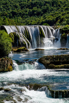 Discover Strbacki buk waterfall surrounded by green hills in Bosnia and Herzegovina's Una National Park