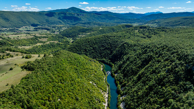 Aerial view of the Una river flowing through lush landscapes of Una National Park in Bosnia and Herzegovina