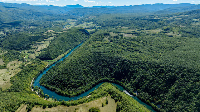 Scenic view of the Una river winding through Una National Park in Bosnia and Herzegovina