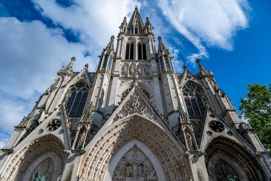 Basilica Saint-Epvre shows detailed architecture under blue skies in Nancy France