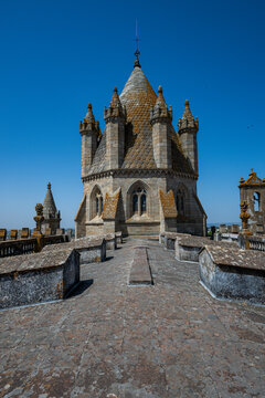 Views from the roof of a historic cathedral in Evora, Portugal with clear blue sky above