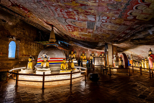 Buddha statues and stupa inside Dambulla cave temple in Sri Lanka showcasing ancient art and cultural heritage
