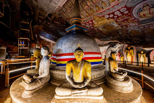 Buddha statues and stupa inside Dambulla cave temple of Sri Lanka