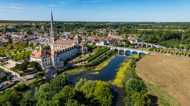 View of Abbey Church of Saint-Savin-sur-Gartempe from above with surrounding landscape and river in France