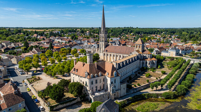 Exploring the aerial view of the Abbey Church of Saint-Savin-sur-Gartempe in France with surrounding landscape