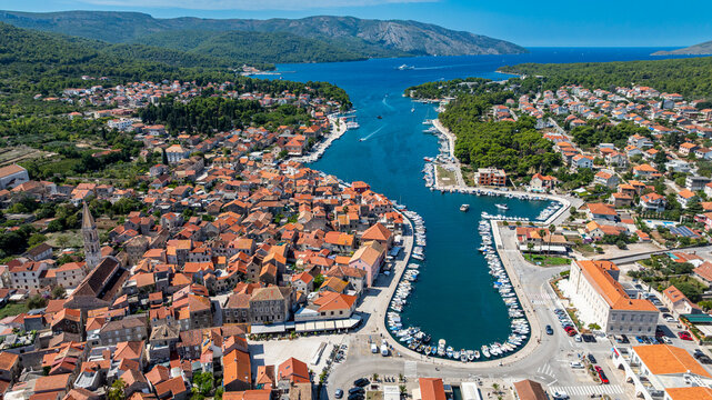 Exploring Stari Grad, an old town with a harbor in Hvar, Croatia, showcasing its unique layout and historical structures