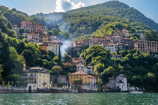 Views of colorful buildings on the hillside overlooking Lake Como in Nesso, a popular destination in Italy