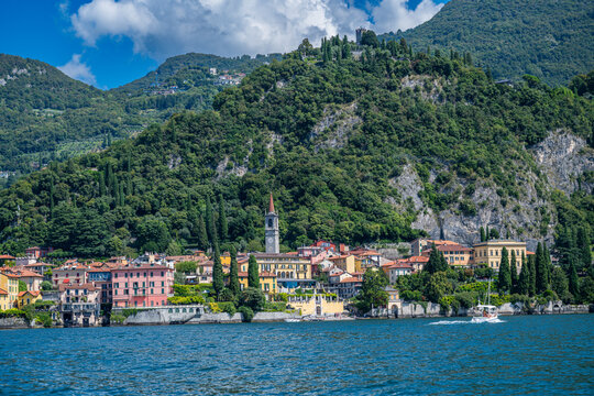 Varenna offers a view of colorful buildings near Lake Como with hills in the background
