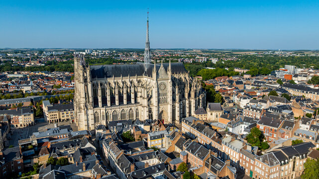 View of Cathedral of Amiens in France showcasing its intricate architecture and surrounding cityscape during bright daylight hours