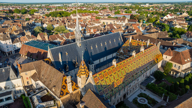 View of Hospices de Beaune in Burgundy, France, showcasing historic architecture and landscape from above at daytime