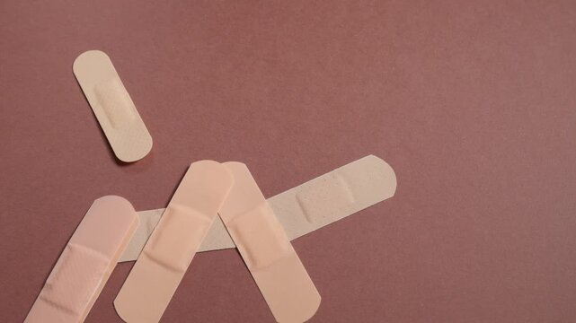 Close-up of a group of adhesive bandages for skin wound healing on a table
