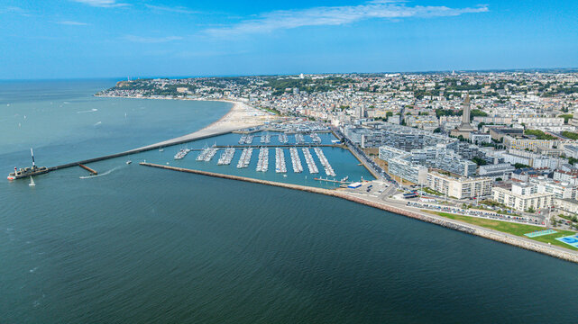 Sports harbour view featuring boats and marina alongside shoreline in Le Havre, Normandy, France