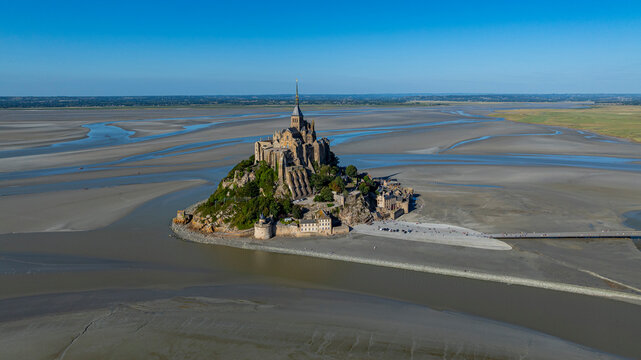 Aerial view of Mont St. Michel showing its distinct architecture and surrounding bay in France