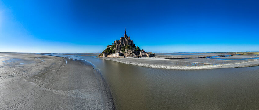 Exploring Mont St. Michel from above shows its unique structure and surroundings in France during a clear day
