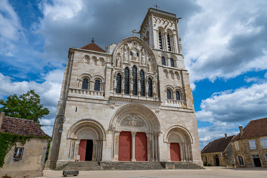 Visit to Vezelay Abbey with its large stone facade and detailed architecture in Vezelay France