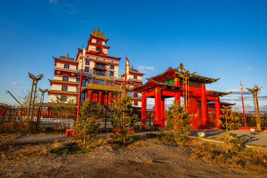 Buddhist monastery with red architecture and blue sky in Kyzyl, Republic of Tuva, Russia