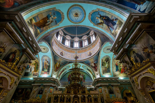 Interior view of the Cathedral of St. Peter and St. Paul showcasing ornate decorations and colorful murals