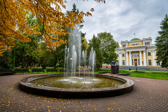 Rumyantsev-Paskevich Residence and fountain in Gomel, Belarus, during autumn season with colorful leaves and visiting tourists