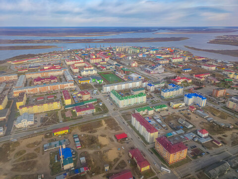 View of Naryan-Mar in Nenets Autonomous Okrug from above with buildings and river