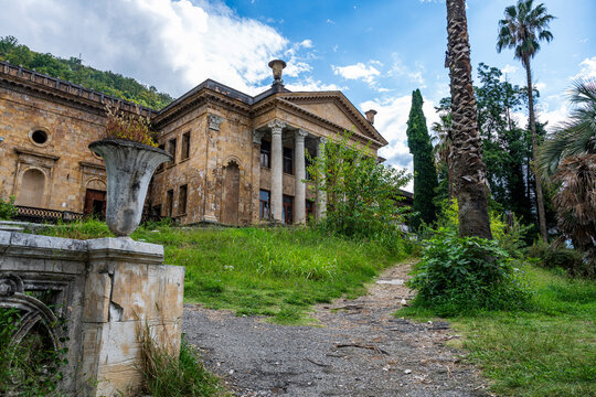 Old theatre in Gagra shows weathered architecture and a blend of nature with history in Gagra, Abkhazia, Russia