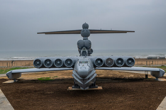 Helicopter displayed on the shore with ocean in the background captured in Dagestan in cloudy weather