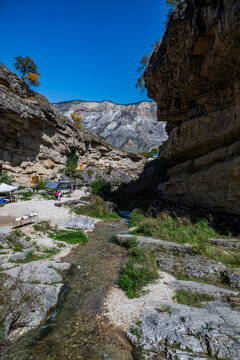 Natural features of Saltinskiy Underground Waterfall area showcase the beauty of Dagestan, Russia in bright daylight with clear blue skies