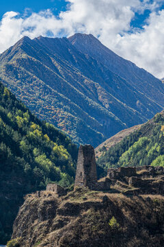 Old watch tower standing on the border of South Ossetia with mountains in the background in North Ossetia, Russia