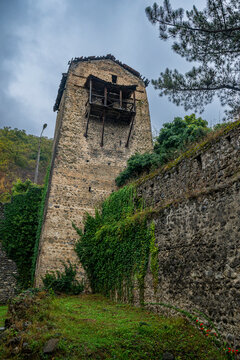 Old watchtower of the Ksani rulers stands tall with greenery surrounding its base in Leningor