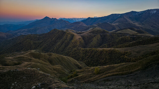 Mountains of Chechnya offer a view of vast terrain and changing colors at dusk in the Caucasus region of Russia