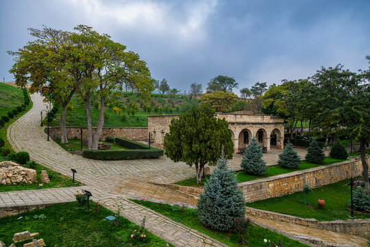 Exploring Naryn-Kala Fortress with stone pathways and green trees in Derbent, Dagestan, Russia