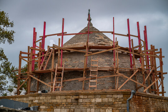 Restoration of the UNESCO world heritage site mosque in Derbent, Dagestan, Russia with scaffolding and workers present
