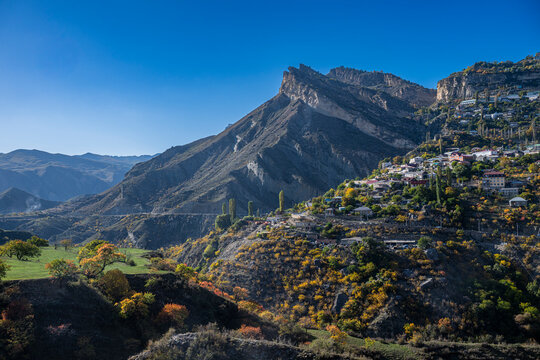 Exploring Gunib village set against the mountain backdrop in Dagestan during the autumn season