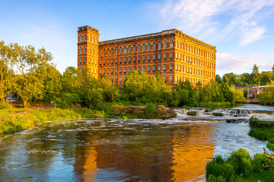 View of Anchor Mill beside White Cart Water in Paisley, Renfrewshire during sunset