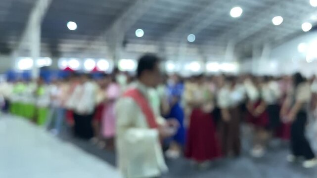 Grand entrance of the cultural dance teams dressed in native costumes during a trade fair presentation.