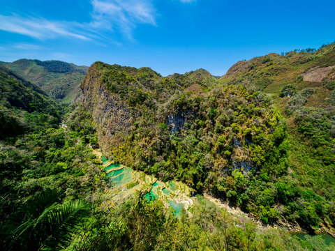 Elevated view of clear turquoise waters and lush greenery in Semuc Champey Natural Monument, Guatemala