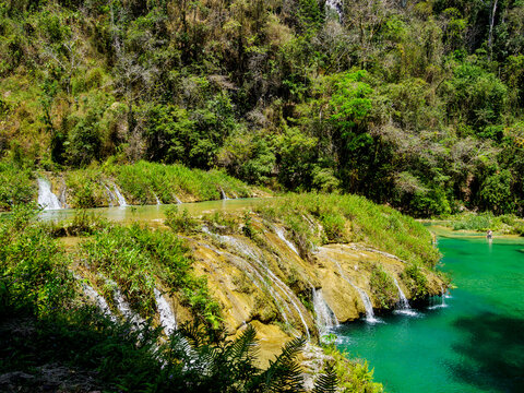 Cahabon River waterfall flows through natural landscape in Guatemala near Semuc Champey