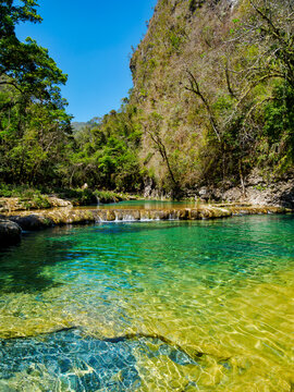 Natural pools at Cahabon River offer clear water and rich landscapes for visitors in Semuc Champey Natural Monument in Lanquin Guatemala