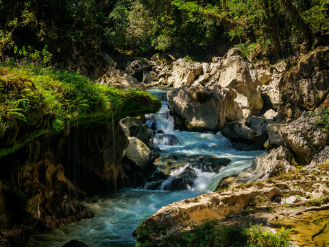 Scenic view of the waterfall at Cahabon River in Semuc Champey Natural Monument during a sunny day in Guatemala