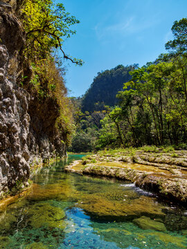 Exploration of natural pools at Cahabon River in Semuc Champey natural monument in Guatemala