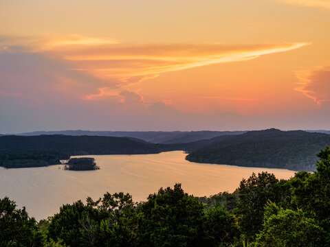 Sunset view of Yaxha Lake from Temple 216 at East Acropolis in Yaxha Archaeological Site in Peten Guatemala