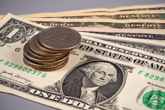 Cash and coins on a table showing different denominations and values