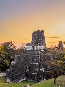 View of Temple II at dusk with changing sky colors in Tikal, Peten, Guatemala