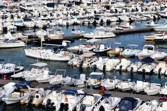 View of Otranto with numerous boats docked in the harbor during the daytime in Puglia region Italy