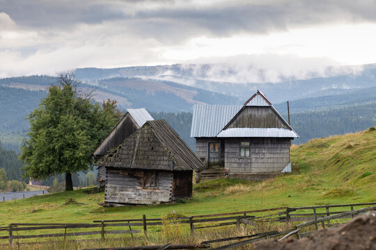 Rural scene in Maguri village showing traditional houses in the Apuseni mountains during overcast weather