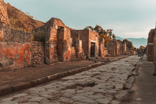 Exploring the ancient structures and streets of Old Pompeii in Campania, Italy during a sunny day with clear skies
