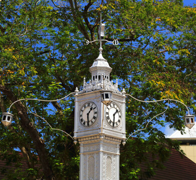 Victoria Clock Tower stands tall in the heart of Seychelles showcasing its historic architecture and lively surroundings