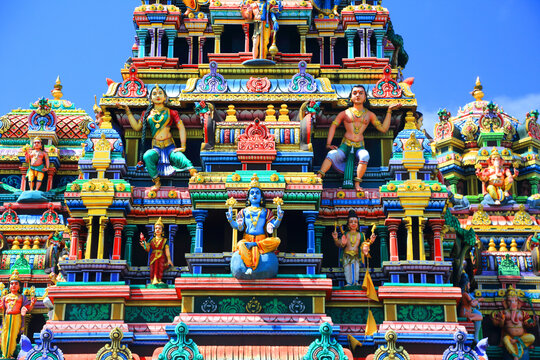 Draupadee Ammen Kovil Hindu Temple showcases intricate designs with colorful figures in Goodlands, Mauritius during bright daylight