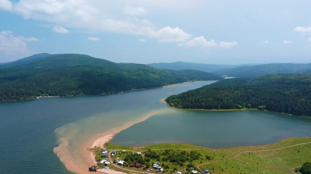 Dospat Reservoir Shiroka Polyana Bulgaria Aerial Drone Camping Beach Sandy Shore Green Mountains Blue Sky Summer Family Travel Tourism Nature Eco Landscape Concept Horizontal Video