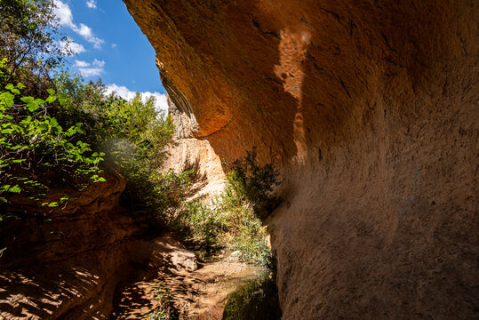 Sunlight highlights the sandstone walls of the Barranco de Luna gorge in Granada, Andalusia, Spain during midday